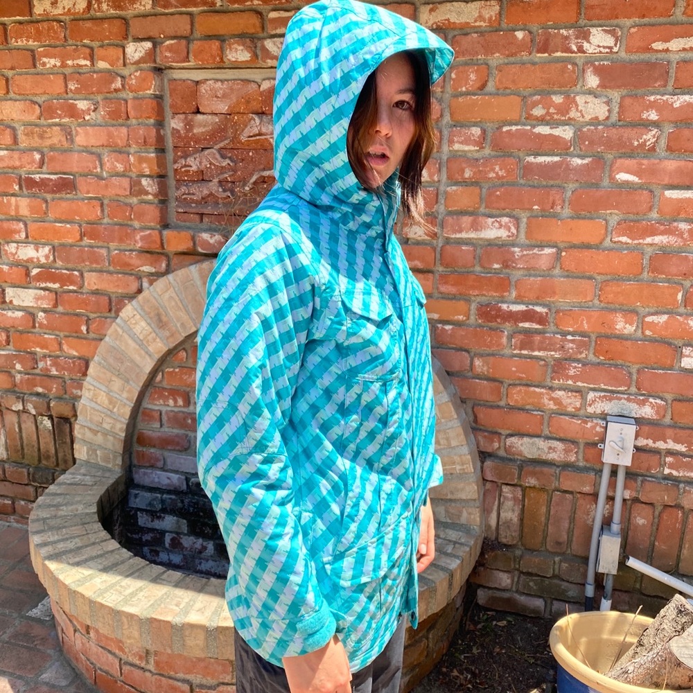 Blue tile snow jacket. Light weight great insulation. Hood fits over a helmet!